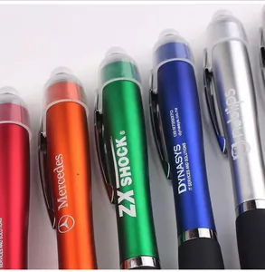 Close-up view of colorful LED ballpoint pens showing custom logo printing details