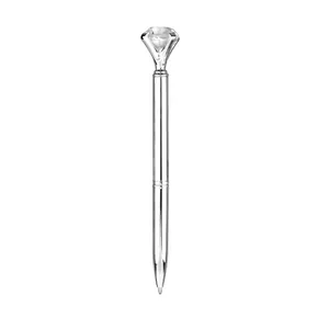 Elegant silver metallic ballpoint pen featuring a large sparkling diamond crystal top
