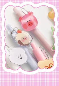 Close-up of cute mini pocket gel pens with colorful acrylic cartoon animal charms