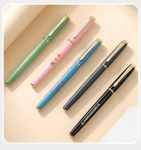 Close-up detail of premium customizable metal gel pens with gold accents in five colors