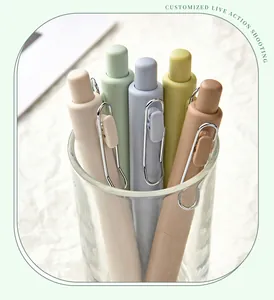 Detail of Morandi retractable gel pens in a glass holder for office and study.