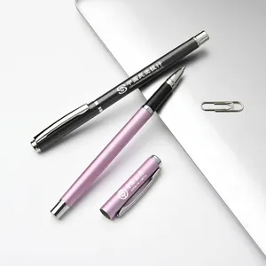 Premium metal business rollerball pens with custom logo printing on office desk