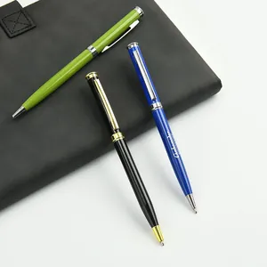 Close-up of premium metal twist ballpoint pens in green, black, and blue finishes.