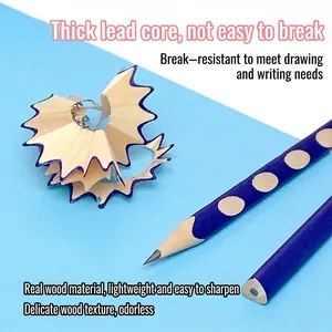 Blue polka dot wooden pencils for sketching and writing with pencil shaving detail