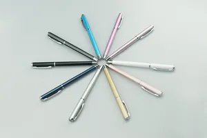 Top view detail of ten slim metal signature pens in various metallic colors for gifts