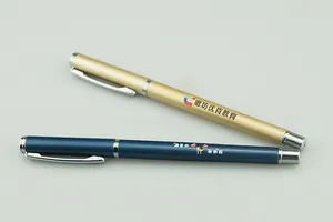Close-up detail view of custom metal business pens in gold and blue matte finish
