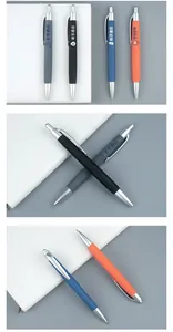Detail view of colorful matte retractable ballpoint pens with custom hotel logos for gifts.
