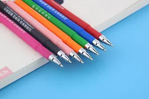 Detailed close-up of colorful customizable gel pens with bullet nibs on a notebook