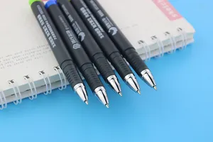 Close-up detail view of customized black gel pens with silver tips on a sketchbook