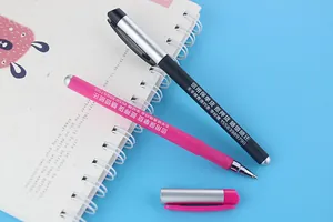 Detail of customizable colorful gel pens with sample text on notebook background.