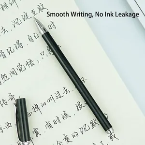 Elegant black metal business pen with silver clip presented on a notebook