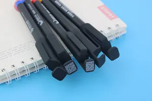 Detail view of black gel pens with functional clips featuring QR codes and phone stands