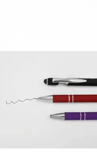 Detail of multi-functional metal stylus pens showing smooth black ink writing