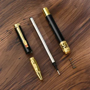 Luxury business metal ballpoint pen with dragon clip disassembled on dark wood surface.