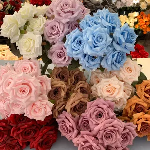 Detailed view of artificial 9-head roses in multiple colors for wedding decoration