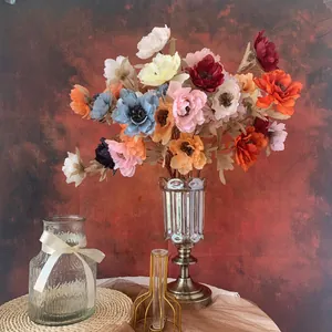Detail view of 3-head artificial peony flowers in a vintage silver vase for wedding decor