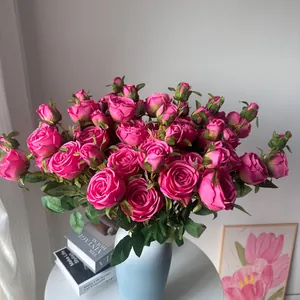 Elegant artificial pink rose silk flower bouquet in a vase for home interior decoration