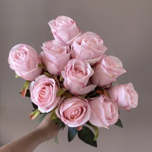 Close-up view of realistic pink artificial Bulgarian roses for home decoration