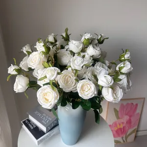 White 3-head silk roses in a decorative light blue vase for home decor
