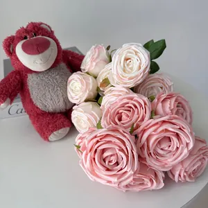 Detail shot of 7-head pink and white artificial rose bouquet for wedding table decor
