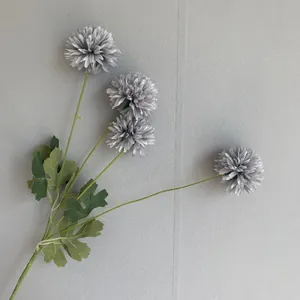 Detail view of grey artificial ball chrysanthemum flowers for home decor