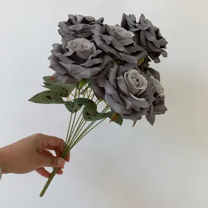 Elegant 9-head artificial gray roses bouquet held by hand for vintage wedding decor