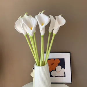 Realistic white PU faux calla lilies bunch in a modern ribbed vase for home decor