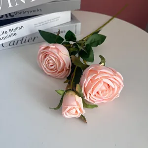 Close-up of artificial 3-head pink silk roses for elegant home and wedding decor