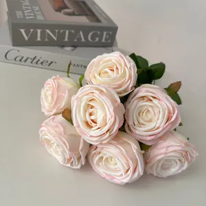 Close-up of a 7-head bouquet of artificial pink and white royal roses for decor.