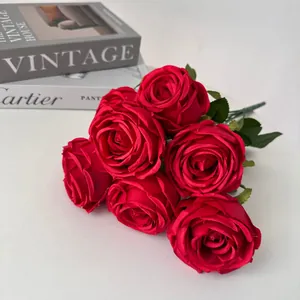 Close-up detail of 7-head artificial red rose bouquet with silk-like petal texture.