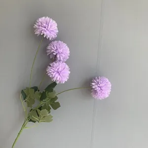 Detailed view of 4-head artificial purple pompon chrysanthemum silk flower stem