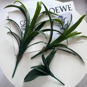 Detailed close-up of artificial orchid leaves for floral arrangement decoration