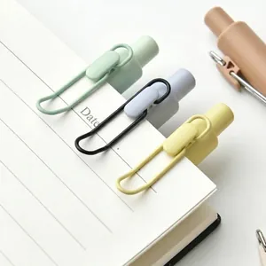 Modern Morandi retractable gel pens featuring colorful hollow metal clips on white notebook