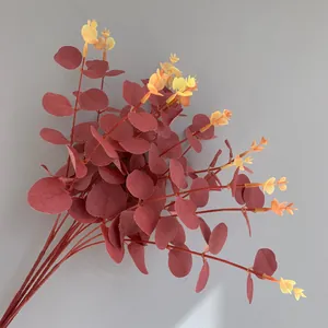 Close-up detail of 16-fork artificial red eucalyptus money leaves with yellow tips