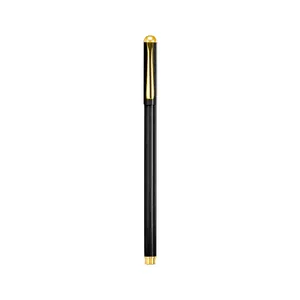 Elegant black metal business gel pen with golden accents isolated on a white background