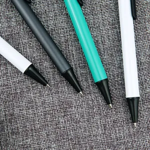 Sleek professional retractable metal pens with matte aluminum barrels on grey fabric