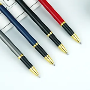 Set of four professional metal ballpoint pens in gray blue black and red for business