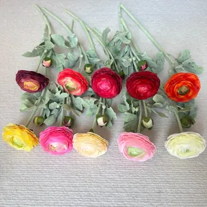 Detailed view of colorful flocked 2-head ranunculus artificial flowers for home decoration
