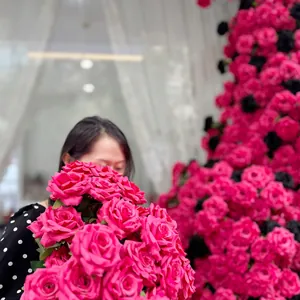 Macro view of realistic pink and black artificial rose petals for flower wall decor