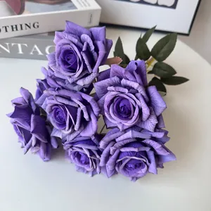 Detailed macro view of a 7-head bouquet of vivid purple artificial roses for home decor