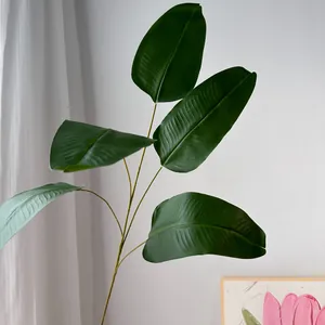 Detail view of artificial green banana leaf stem for French garden wedding decor