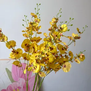 Detail shot of high-quality artificial yellow Oncidium orchids with realistic texture