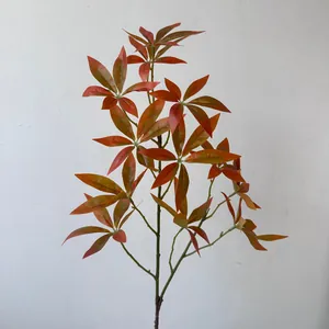 Close-up detail of artificial autumn money leaves branch for home and wedding decor