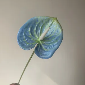 Detailed close-up of a French Monet style blue artificial Anthurium flower for wedding
