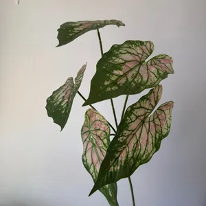 Macro view of 3D printed artificial Caladium leaves with realistic pink veins.