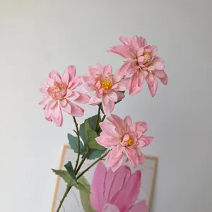 Close-up view of delicate pink artificial dahlia flowers for French Monet style wedding decor
