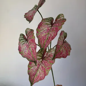 Detailed close-up of 3D printed artificial Caladium leaves with pink and green patterns.