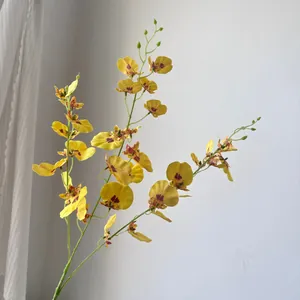 Realistic artificial yellow dancing lady orchid branch for high-end home decoration.