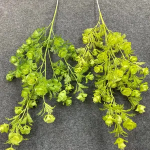 Detailed macro shot of Korean style lime green artificial vines for wedding ceiling decor