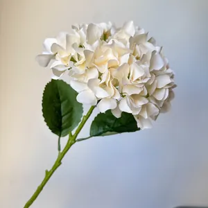 Elegant creamy white artificial hydrangea stem with realistic green leaves for wedding decor